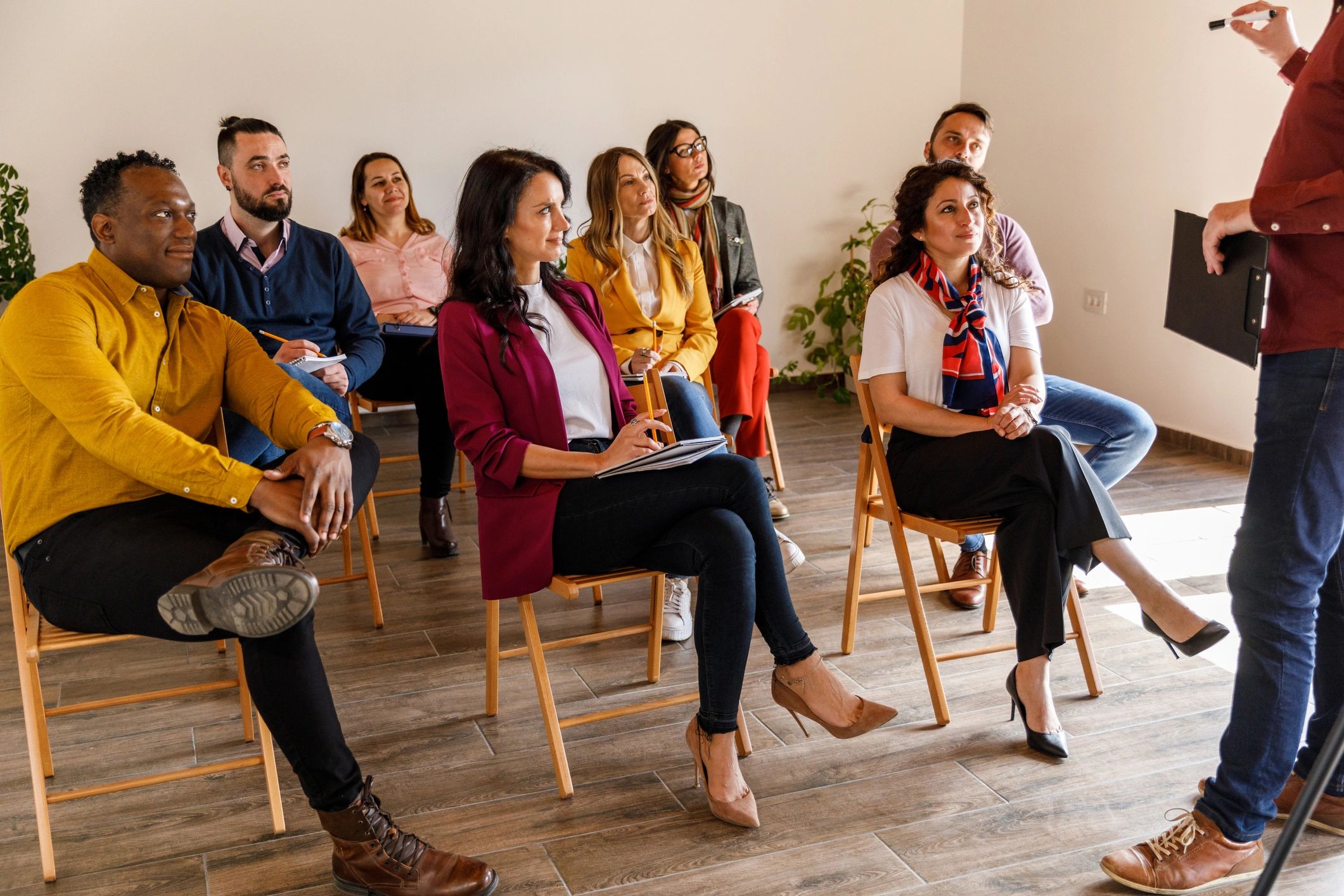Group seated and listening attentively during a meeting