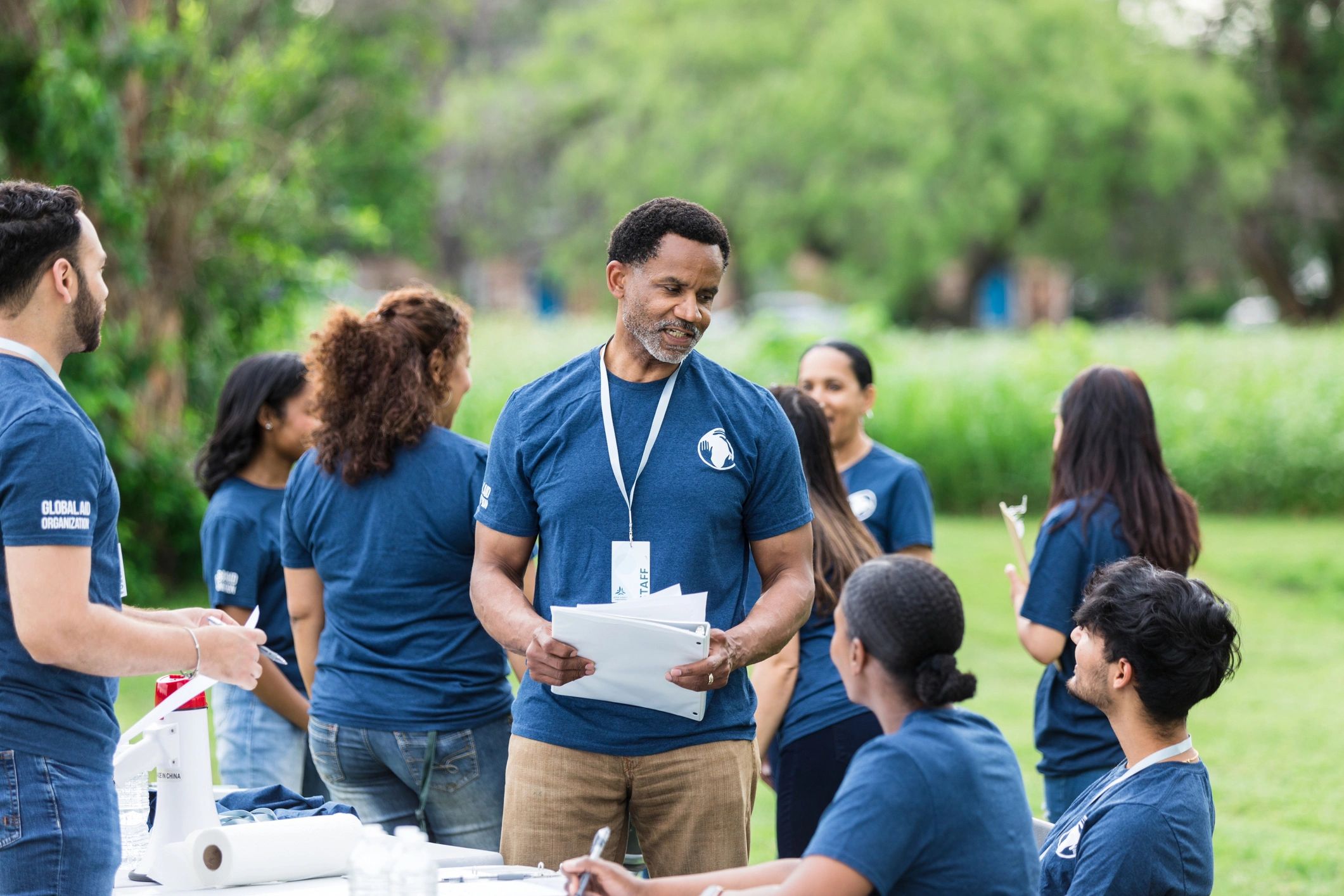 Volunteer leader speaking with a team before an event